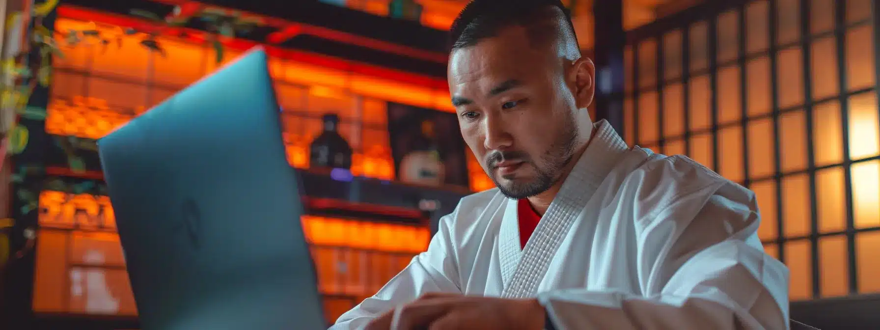 a martial arts dojo owner analyzing keyword research data on a laptop with qr codes and backlinks displayed in the background to boost their online visibility.